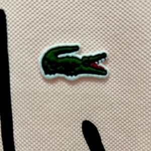 Lacoste Polo Shirt color Pink size L with prints on Front